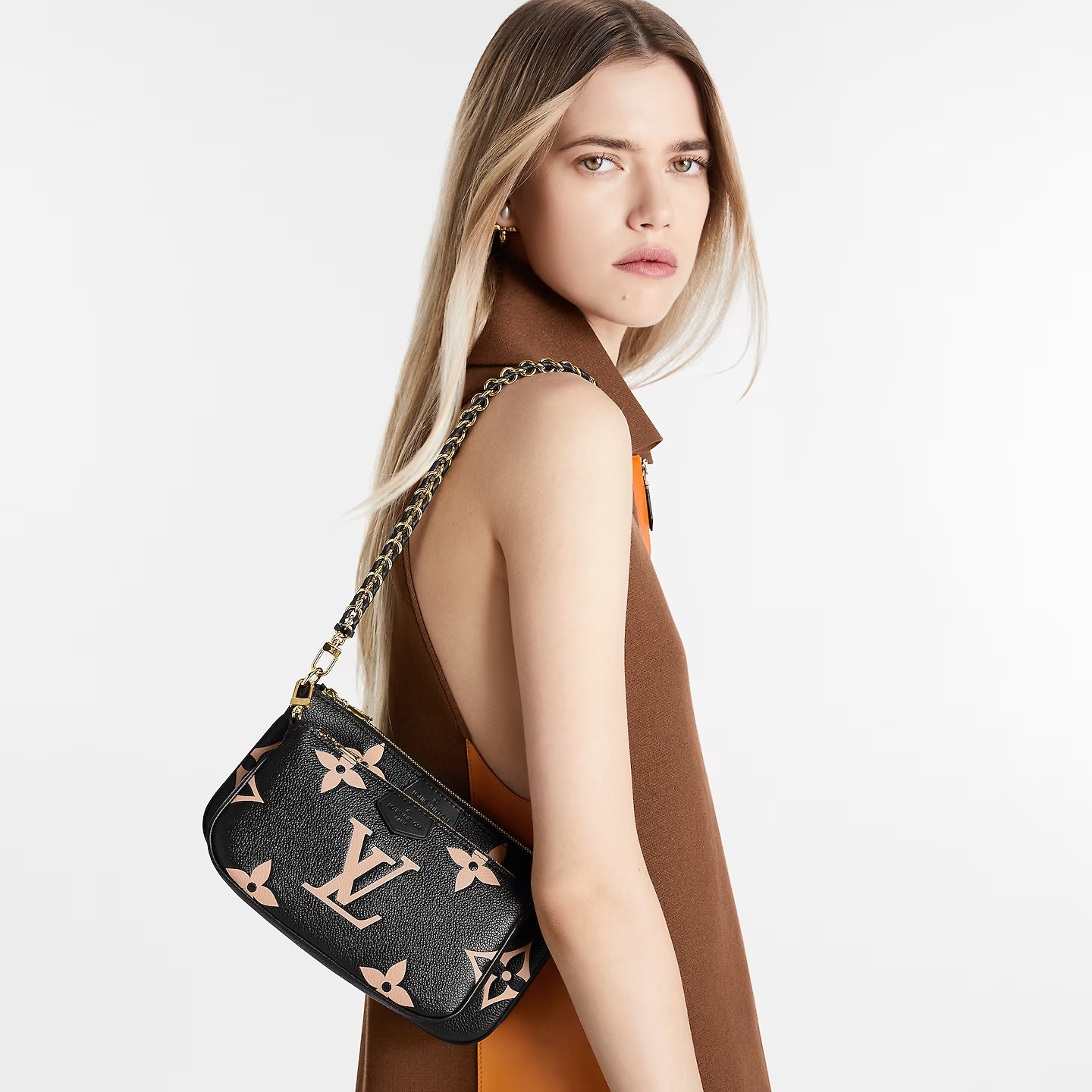 louis-vuitton-multi-pochette-accessoires-bicolor-monogram-empreinte-leather-handbags-M45777_PM1_Worn-view.jpg