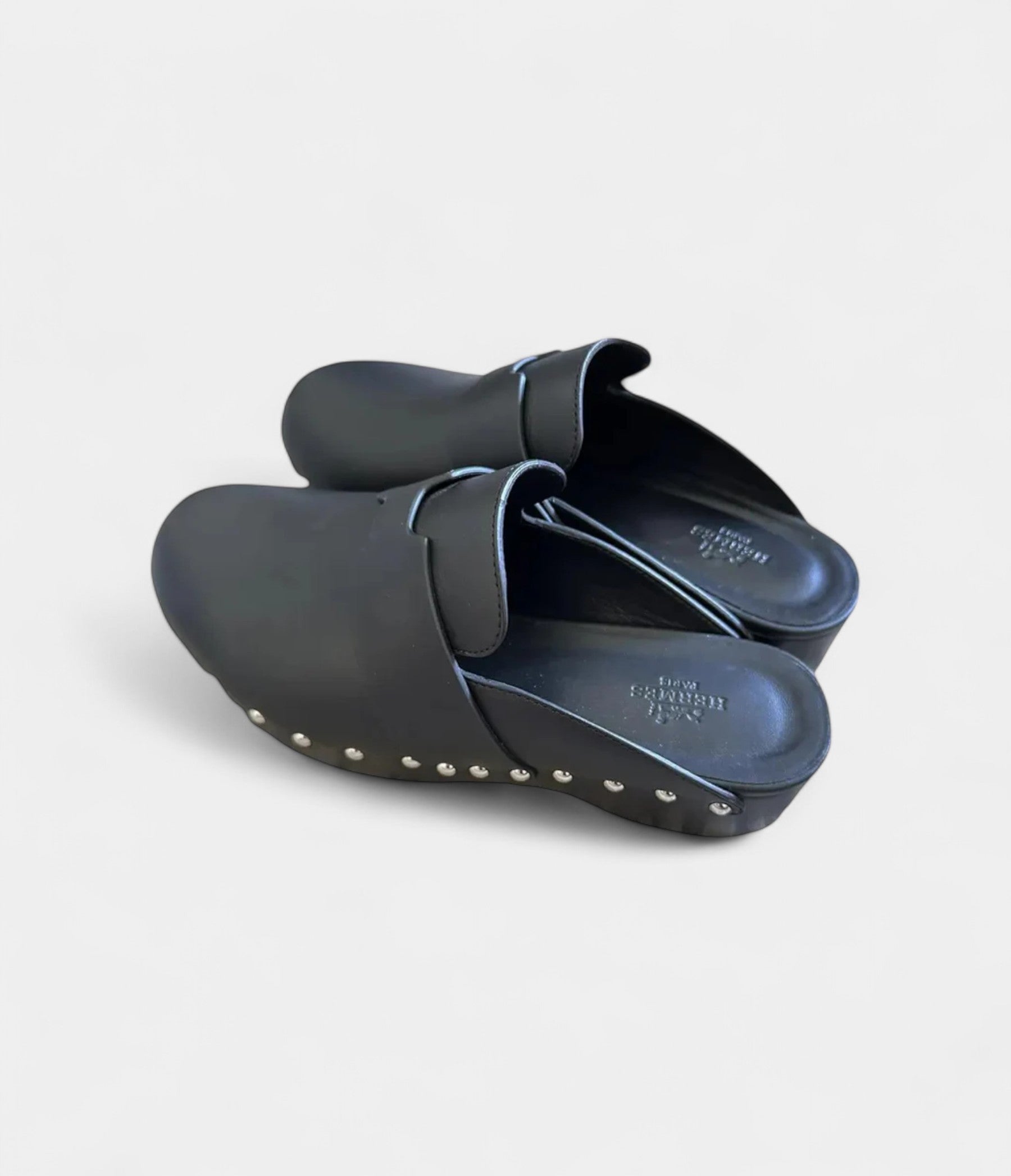 Hermès Calya Leather Mules & Clogs Where Sculptural Design Meets Effortless Luxury