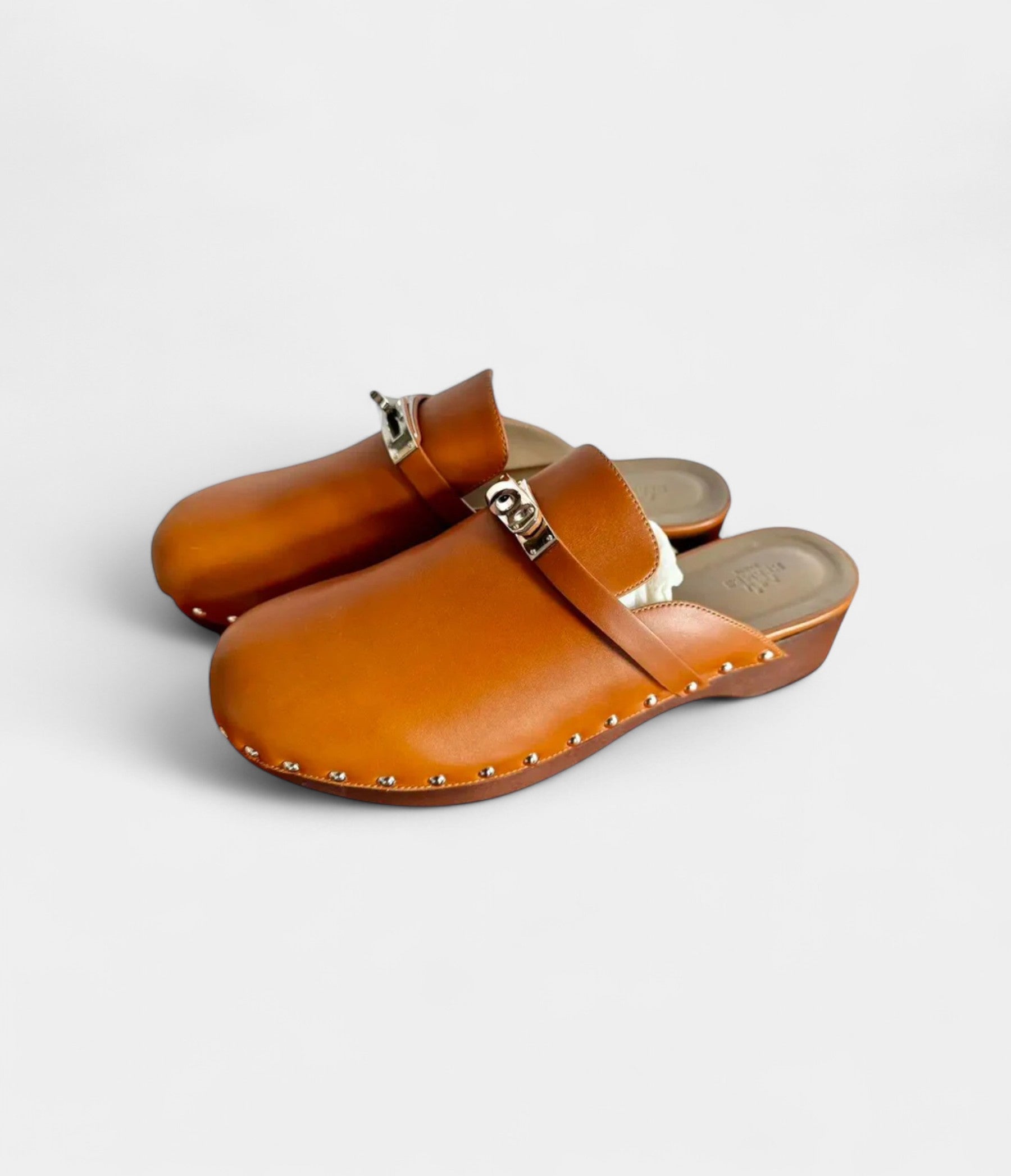 HermesCarlottaLeatherMules_ClogsTimelessComfortwithSophisticatedFlair_1_05b2c83e-2cb4-4675-a2cd-b75ed002e10b.jpg Hermès Carlotta Leather Mules & Clogs Timeless Comfort with Sophisticated Flair