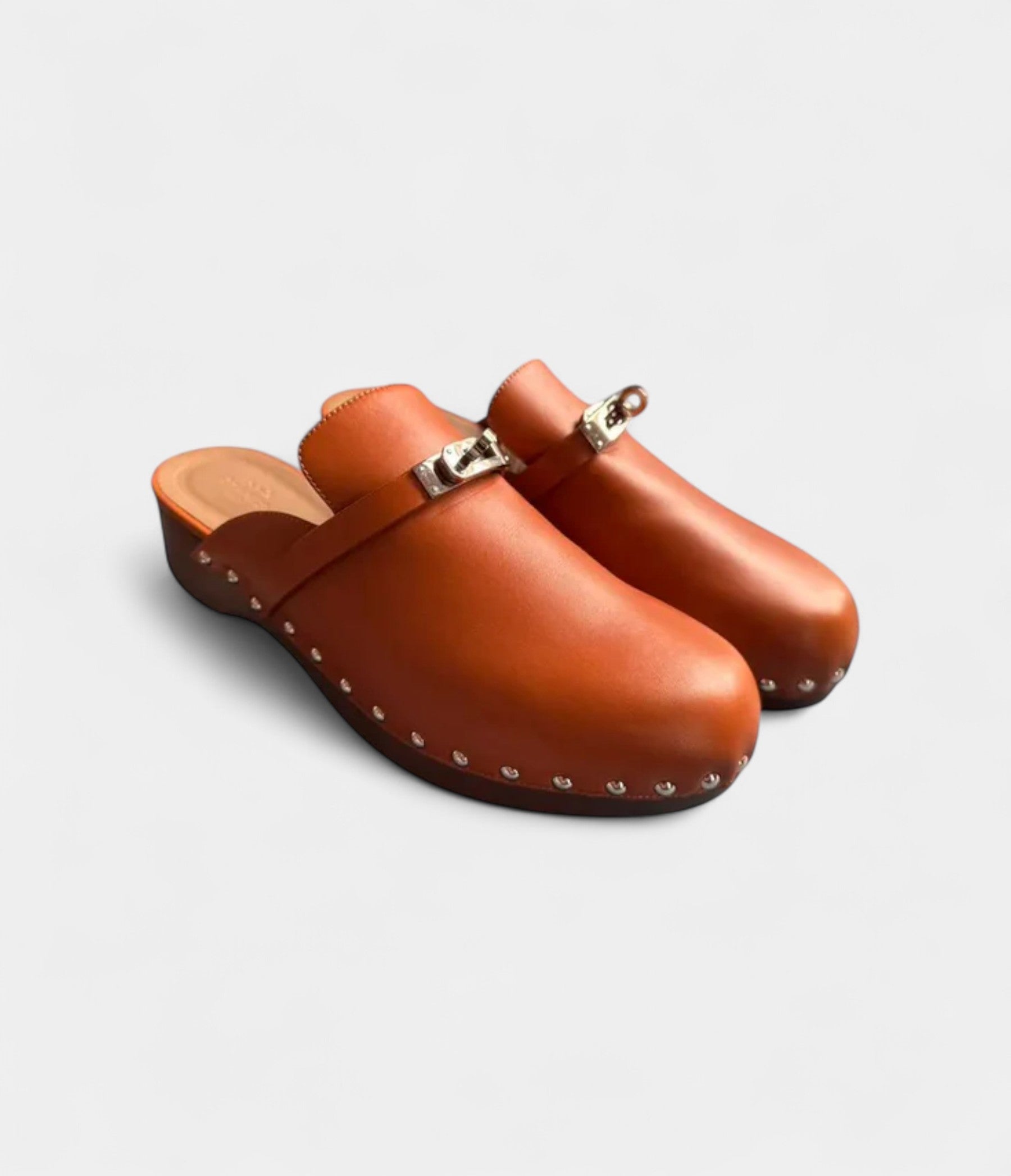 Hermès Carlotta Leather Mules & Clogs Timeless Comfort with Sophisticated Flair