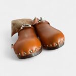 Hermès Carlotta Leather Mules & Clogs Timeless Comfort with Sophisticated Flair