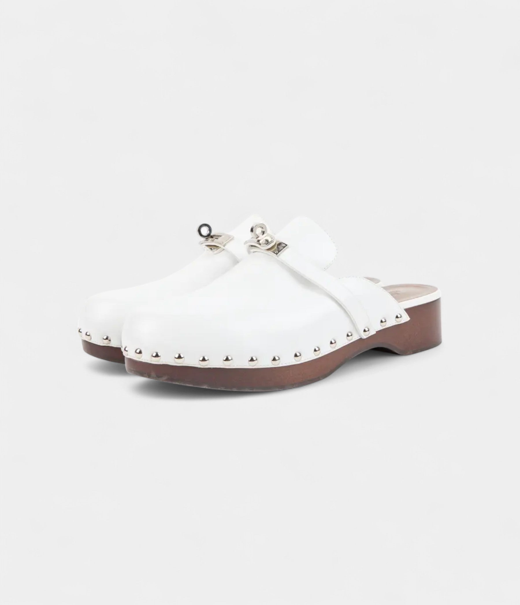 Hermès Carlotta White Leather Mules with Studded Wooden Platform and Palladium Hardware