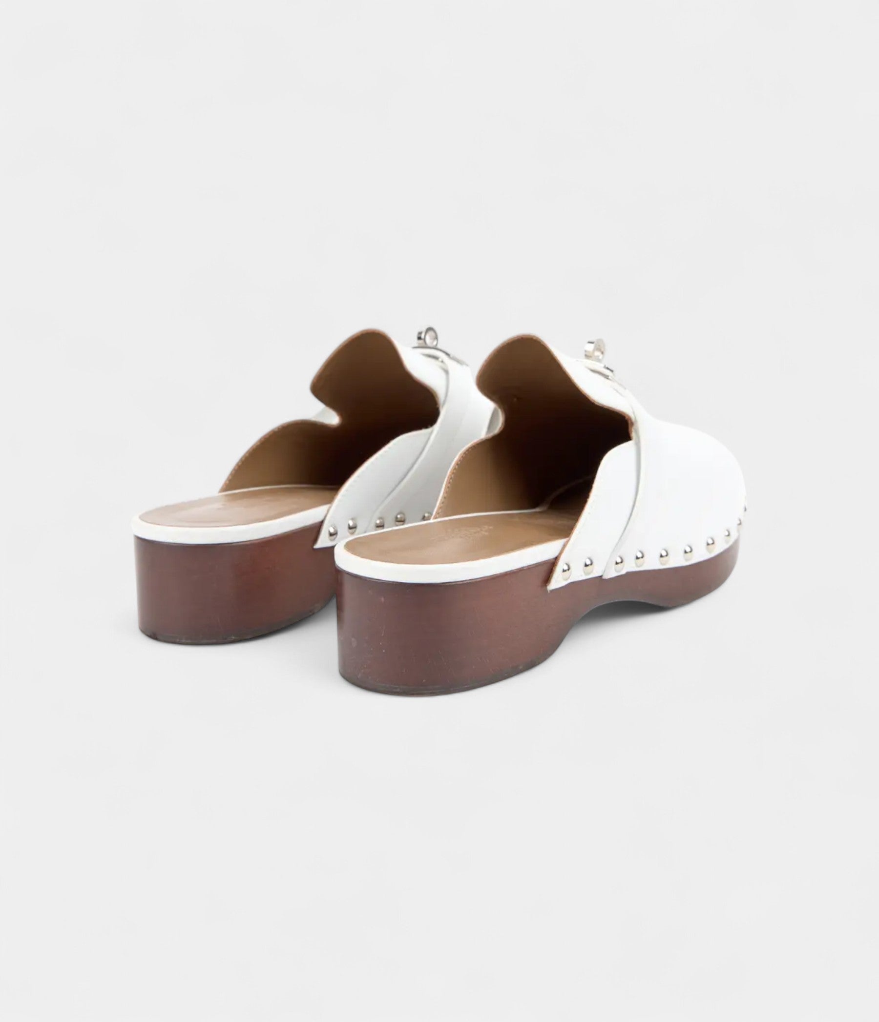 Hermès Carlotta White Leather Mules with Studded Wooden Platform and Palladium Hardware