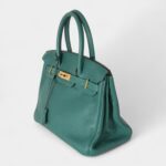 The Hermès Birkin 30 Green Leather Handbag is a timeless symbol of luxury