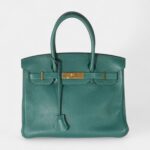 The Hermès Birkin 30 Green Leather Handbag is a timeless symbol of luxury
