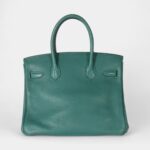 The Hermès Birkin 30 Green Leather Handbag is a timeless symbol of luxury