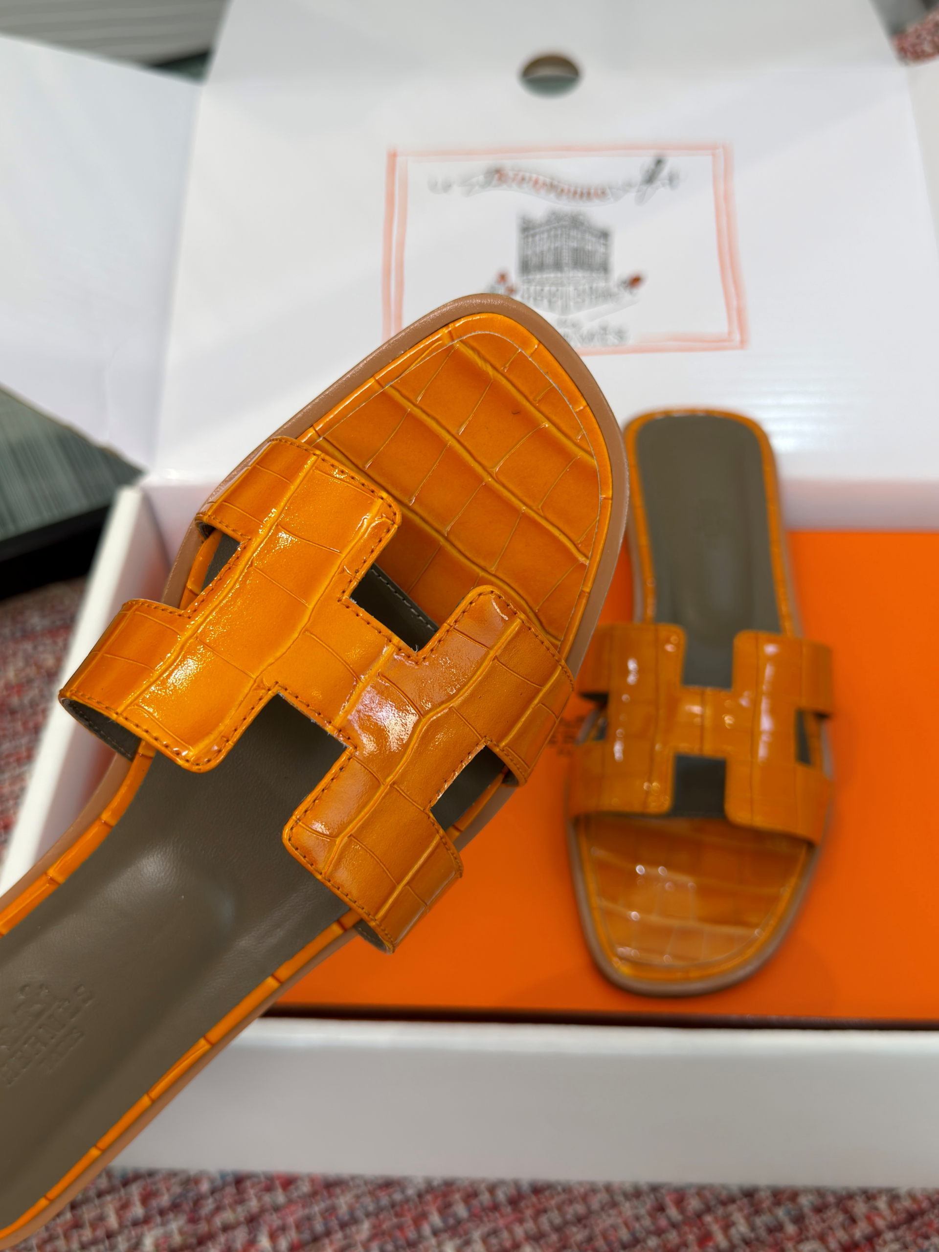 Hermès Oran Sandals for Women In Summer Quick Dry Leather with orange